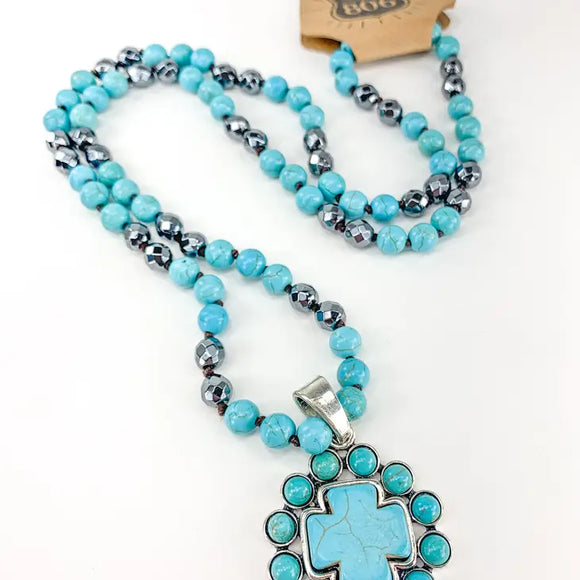 DECORATIVE CROSS PENDENT ON BEADED NECKLACE